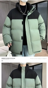 Detailed view of padded puffer jacket with stand-up collar and black-green contrast panels