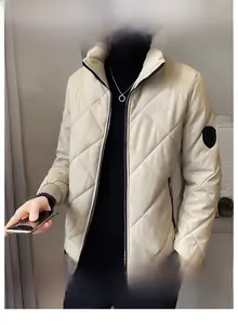 Close-up of men's quilted puffer jacket with stand collar and diamond stitch detail