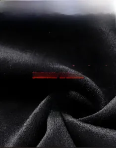 Macro shot of premium black fleece fabric showing warm texture and durable soft fibers