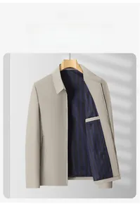 Detail of khaki men's business jacket featuring striped lining and interior chest pocket