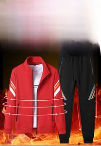 Detail of red stand collar track jacket with sleeve stripes and black drawstring pants