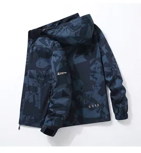Detail of waterproof camouflage hiking jacket with hood and functional zip pockets