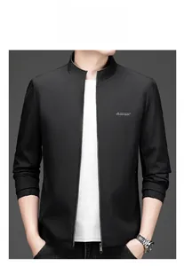Detail of men's stand collar black jacket with embroidered logo and metal zipper