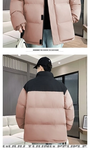 Detail of two-tone padded jacket featuring stand collar and elastic cuffs in pink and black