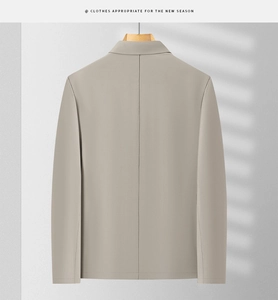 Back view of a men's light grey business casual jacket with minimalist middle seam detail