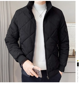 Close-up of black quilted men's winter jacket featuring ribbed cuffs and a stand collar