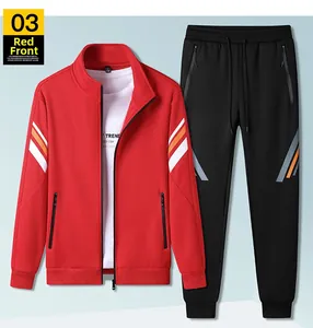 Detail view of a red zip-up jacket and black joggers with stripe pattern