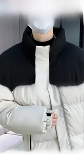 Detail of high stand collar and elastic cuffs on two-tone winter padded jacket