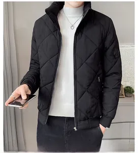 Detail showing black diamond quilted texture and stand-up collar on men's winter jacket