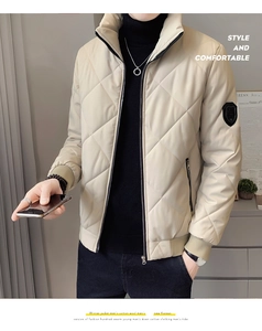 Detail of men's beige quilted stand collar jacket with black zippers and ribbed cuffs