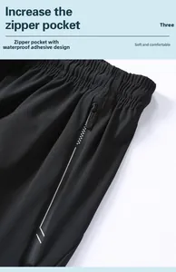 Detail of men's quick-dry shorts featuring a waterproof zippered pocket and elastic waist
