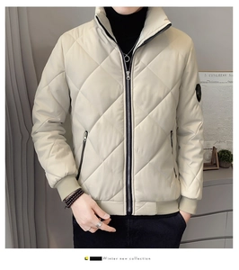 Detail of quilted stand-collar men's jacket in beige with premium ribbed cuffs