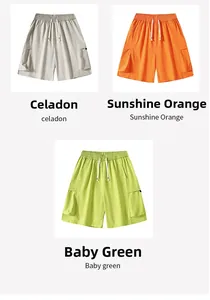Close-up of men's cargo shorts showing celadon, orange and baby green color options