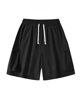 Detail of black cargo shorts with elastic waist, contrast drawstring and flap pockets