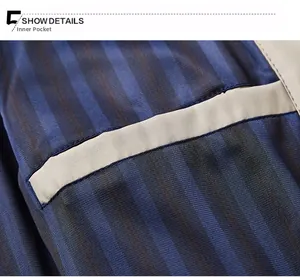 Detailed macro shot of the functional inner pocket and navy blue striped lining of the jacket