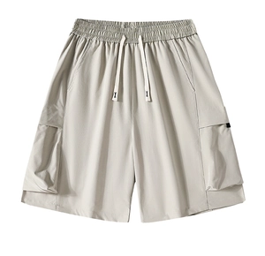 Detailed view of elastic waistband with white drawstring and pocket on cargo shorts