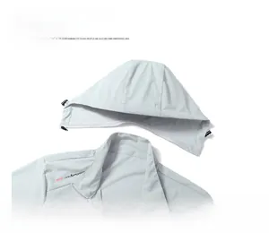 Detail of light gray summer sun protection jacket with detachable hood and chest logo