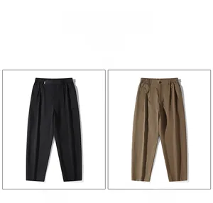 Detail view of men's casual straight trousers in black and coffee with pleated finish