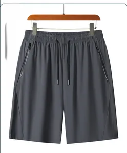 Detail of men's dark grey ice silk shorts with elastic drawstring waist and zipper pockets
