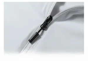 Close-up of black FASHION zipper puller on light gray quick-dry sun protection jacket