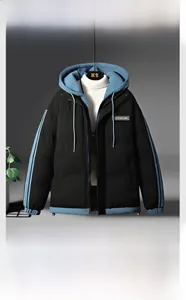 Detail of hooded men's winter jacket featuring contrast blue lining and windproof design