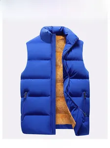 Detail of blue quilted vest with vibrant orange fleece lining and stand collar