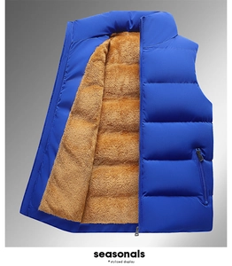 Detail of blue puffer vest with warm sherpa fleece lining and smooth zipper closure