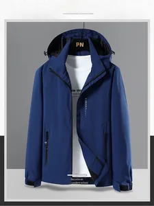 Detail view of a men's navy hooded windbreaker with functional zippers and adjustable cuffs