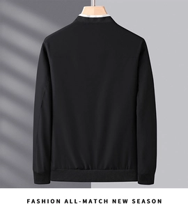Rear view of black minimalist men jacket featuring ribbed cuffs and stand collar details