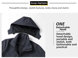 Detail of dark grey hiking jacket showing detachable hood, zipper, and mesh lining