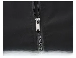 Close-up of premium black resin zipper and polished silver metal slider on baseball jacket