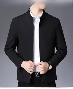 Detail of men's business jacket showing stand collar, zipper closure, and classic leather belt