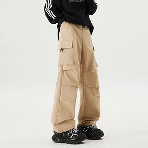 Pantalon cargo ample kaki pour homme avec grandes poches latérales et style parachute