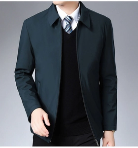Close-up of a men's classic dark green business jacket with zipper and collar detail