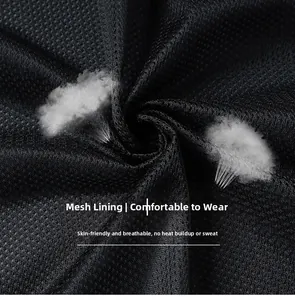 Close-up of black mesh lining showing breathable honeycomb texture for hiking jackets