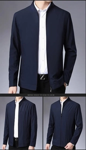 Detail view of a men's navy blue business jacket with stand collar and sleek metal logo