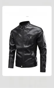 Detail of vintage black leather jacket featuring stand collar and metal zipper pockets