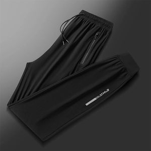 Pantalon de sport en soie glacée noire pour homme avec taille élastique et poches zippées