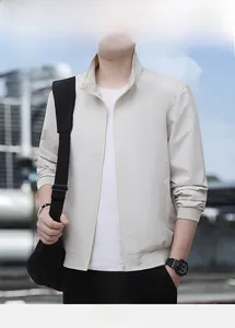Detail of light beige casual jacket with classic stand collar and ribbed cuffs and hem