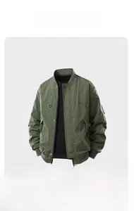 Detailed view of military green bomber jacket with ribbed collar and utility cargo pockets