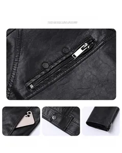 Detail view of black faux leather motorcycle jacket featuring metal zippers and buckles