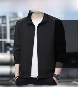 Close-up of black casual men jacket with stand collar and elastic cuffs in outdoor setting