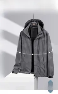 Close-up of light grey waterproof jacket with geometric twill texture and drawstring hood