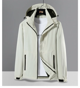 Detail of light grey outdoor windbreaker jacket featuring windproof hood and zipper pocket