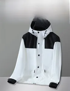 Detail view of the adjustable velcro cuffs and stitching on the windbreaker jacket