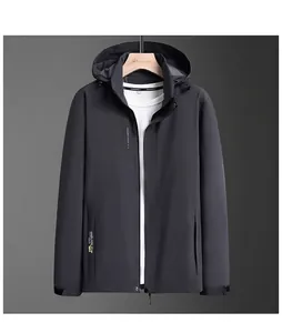 Detail of grey hooded jacket with yellow text embroidery and adjustable drawstrings