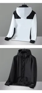Front and back views of hooded color-block outdoor jacket with Fearless print details