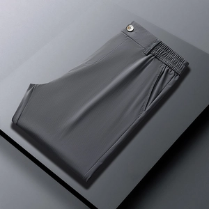 Men's dark gray business casual trousers with textured breathable fabric and elastic waist