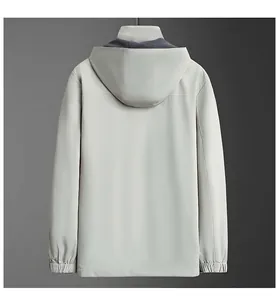 Back view of a light grey men's hooded windbreaker jacket for casual business style