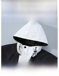 Detail view of the windproof hood with adjustable drawstring on a color-block jacket